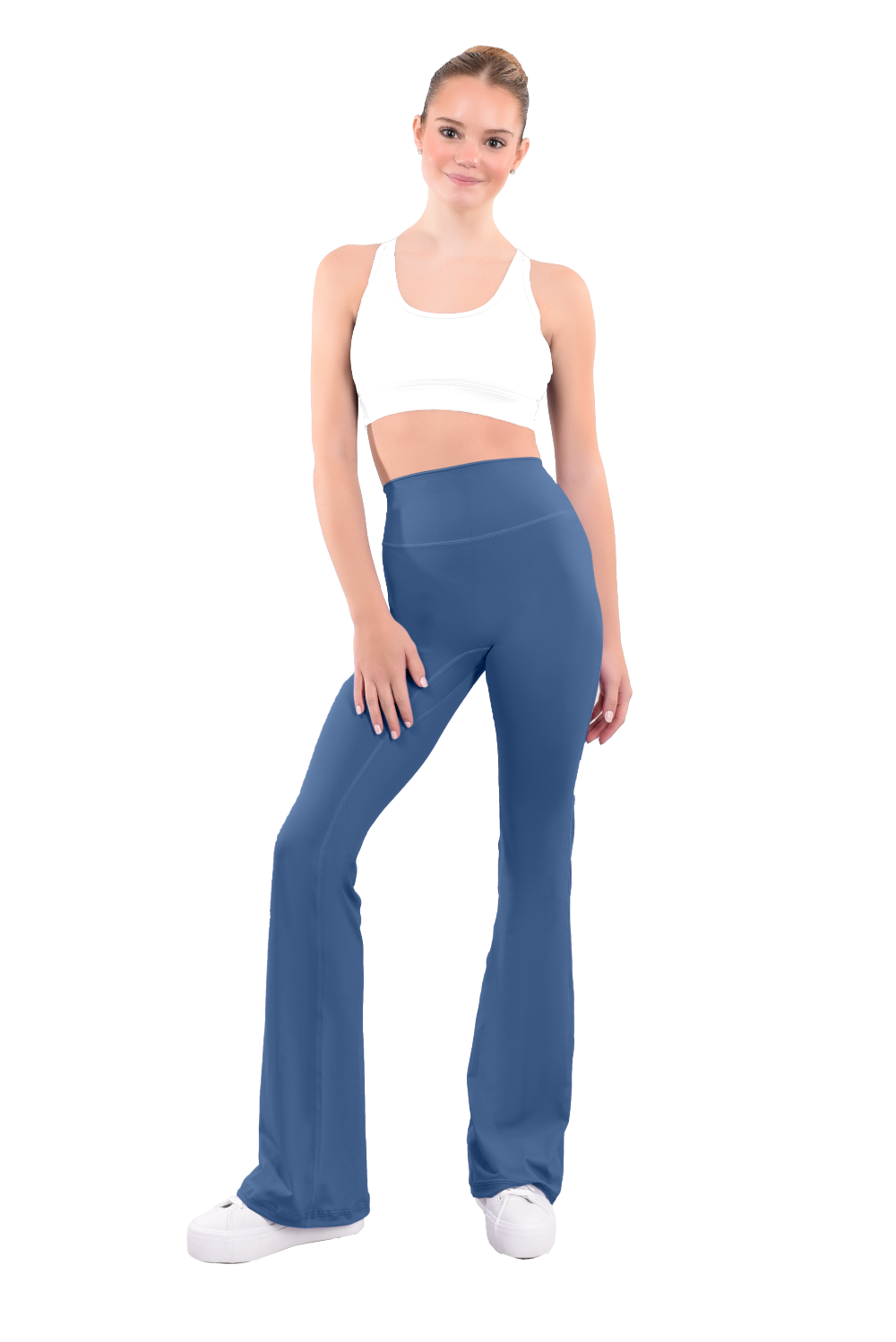 dancer in white sports bra and ash green high rise flared stretch fit pants