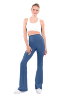 dancer in white sports bra and ash green high rise flared stretch fit pants