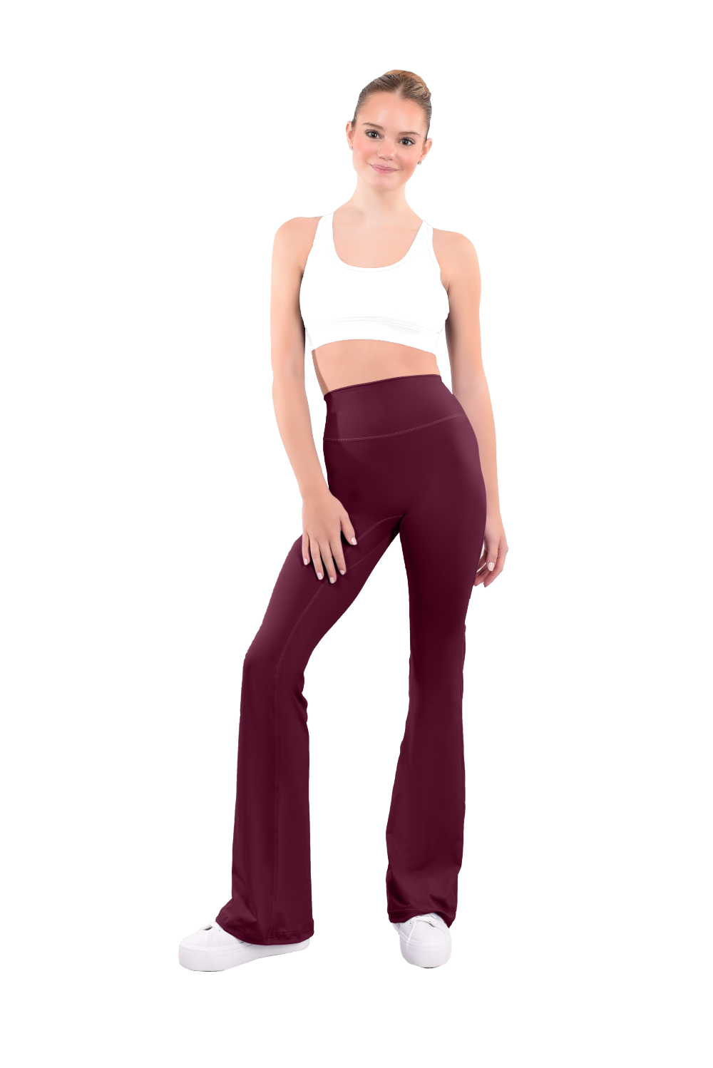 dancer in white sports bra and burgundy high rise flared stretch fit pants