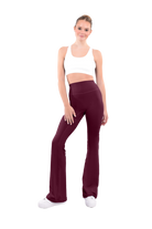 dancer in white sports bra and burgundy high rise flared stretch fit pants