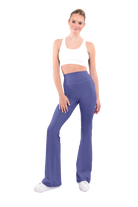 dancer in white sports bra and comet high rise flared stretch fit pants