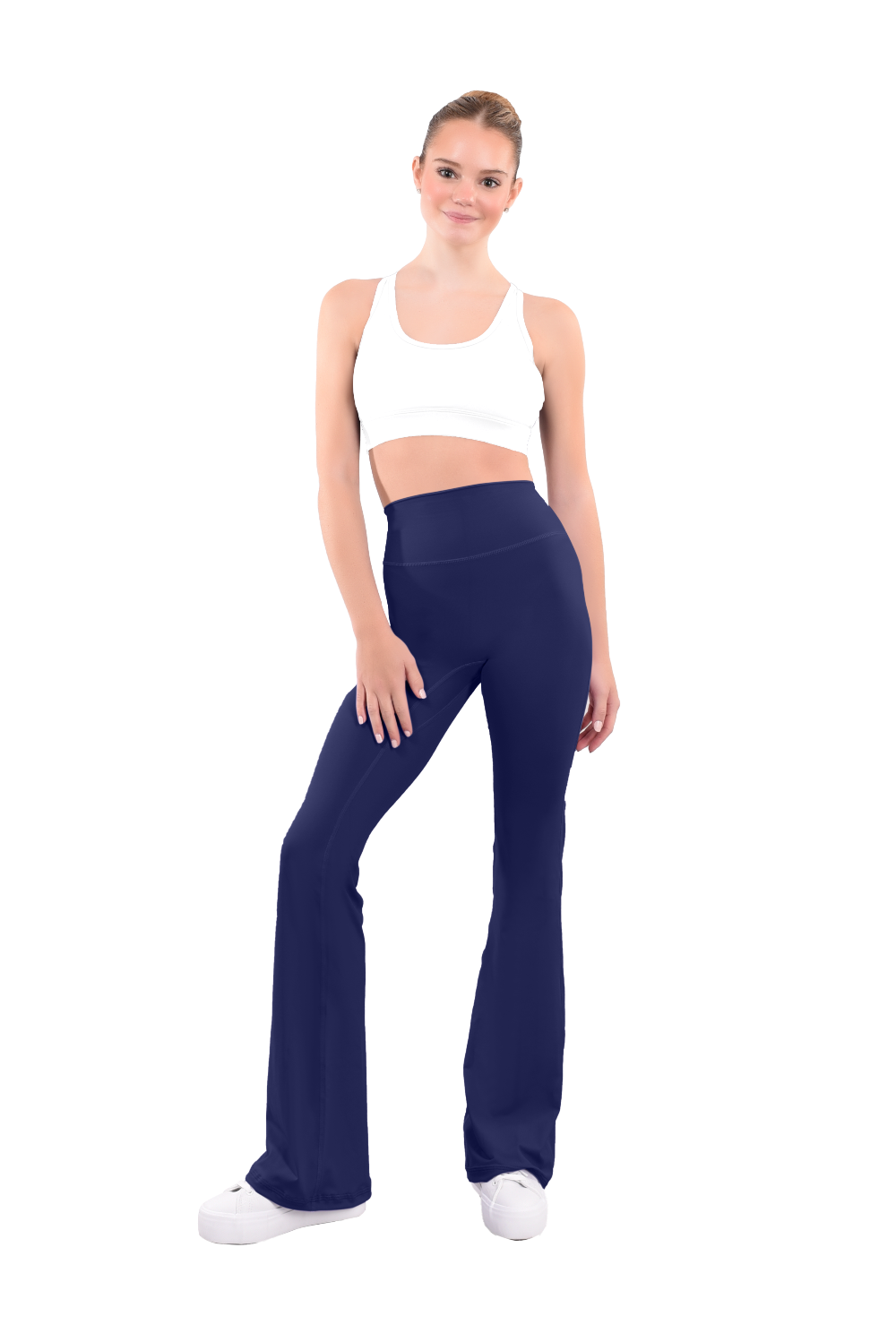 dancer in white sports bra and deepsea blue high rise flared stretch fit pants