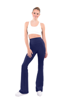 dancer in white sports bra and deepsea blue high rise flared stretch fit pants