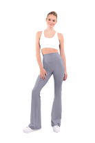 dancer in white sports bra and dolphin gray high rise flared stretch fit pants