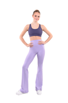 dancer in purple sports bra and lavender high rise flared stretch fit pants