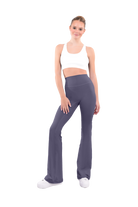 dancer in white sports bra and midnight gray high rise flared stretch fit pants