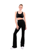 dancer in black sports bra and black high rise flared stretch fit pants