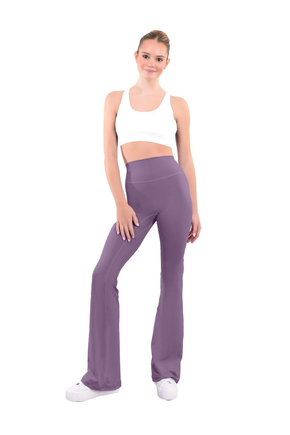 dancer in white sports bra and Tuscan red high rise flared stretch fit pants