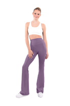 dancer in white sports bra and Tuscan red high rise flared stretch fit pants